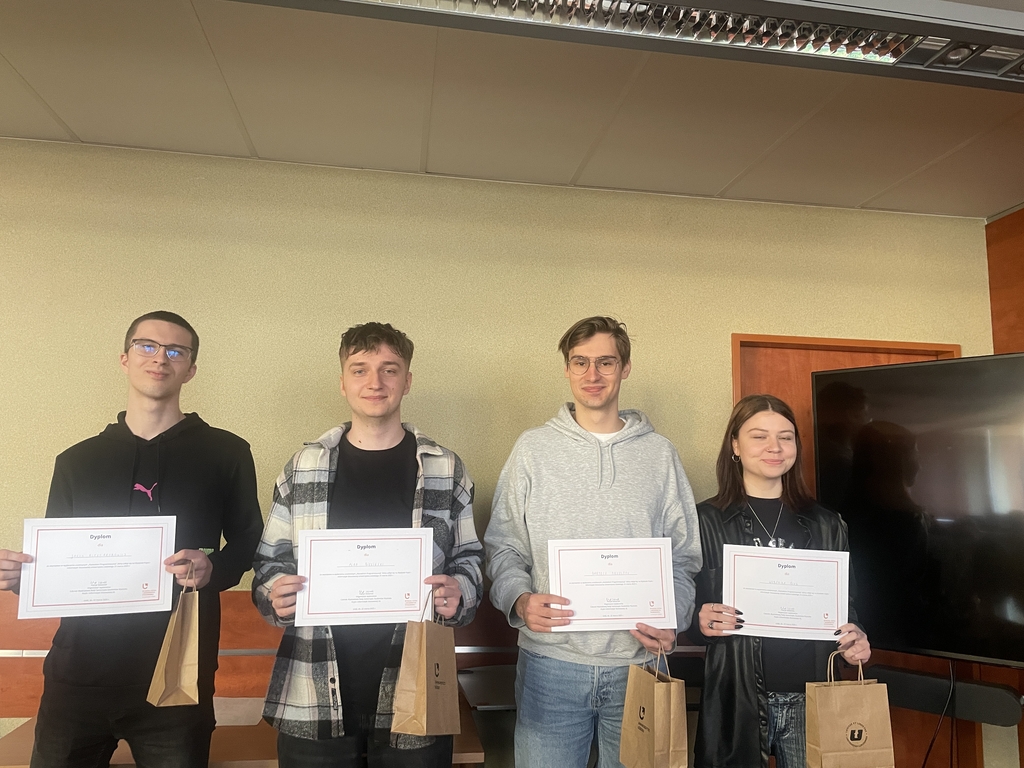 a group of students with diplomas